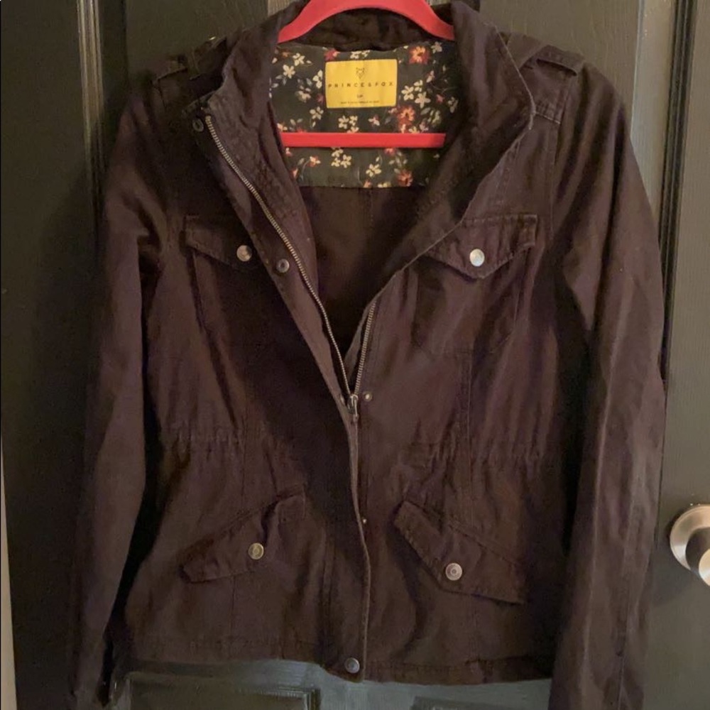 black jacket with zipper and buttons